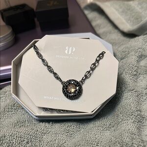 Elegant Black and Silver Necklace by [Brand]